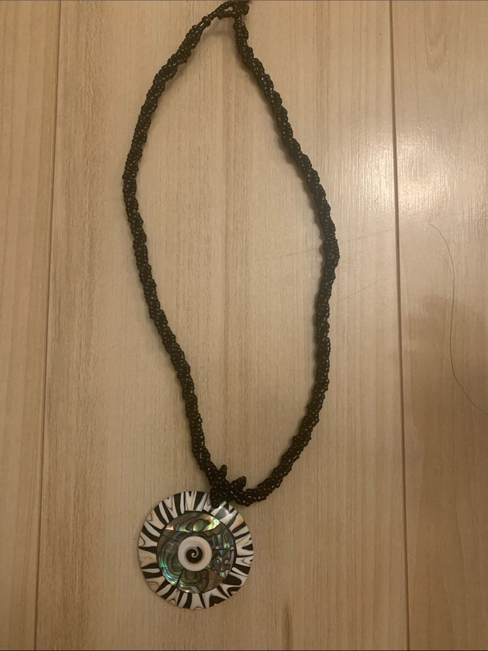 Black Beaded Necklace with Iridescent Abalone and Zebra Accent Pendant